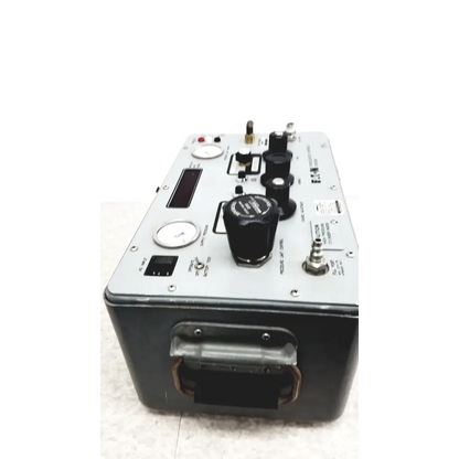 Silver and black Eaton UPC5000 consolidated controls pressure calibration standard with multiple knobs and gauges