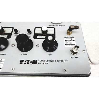 Silver metallic Eaton UPC5000 consolidated controls pressure calibration standard panel with black knobs and labeled dials