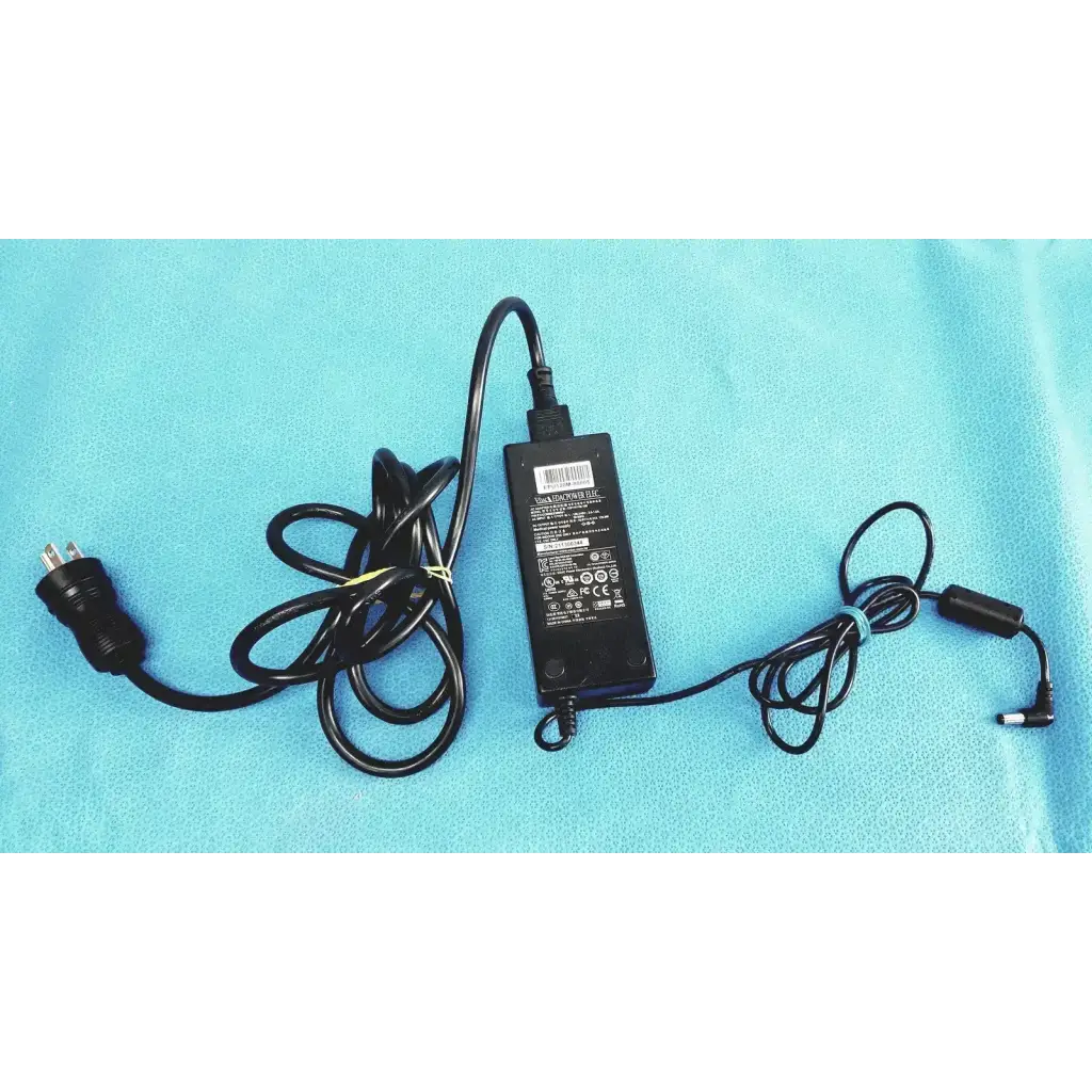 Black plastic edacpower elec em110111m-190 adapter power supply with coiled power cord and detachable connector