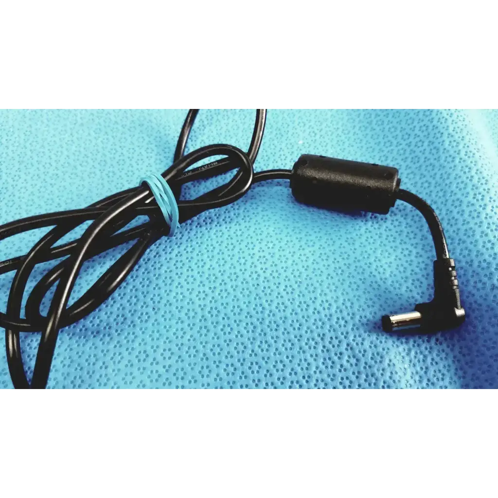 Black coiled adapter power supply cable with matte plastic housing and angled connector for EDACPOWER EM110111M-190