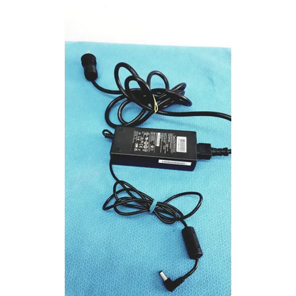 Black plastic edacpower elec em110111m-190 adapter power supply with coiled cord and multiple certification labels