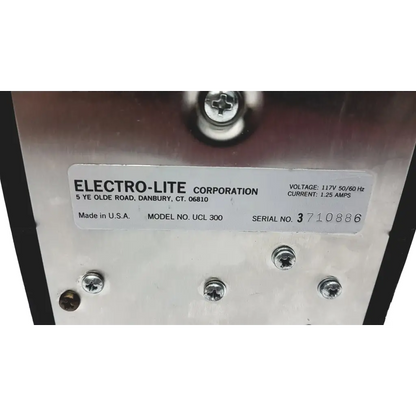 Silver metallic industrial power supply unit of the teklite uv curing unit ucl 300 with model and serial number label