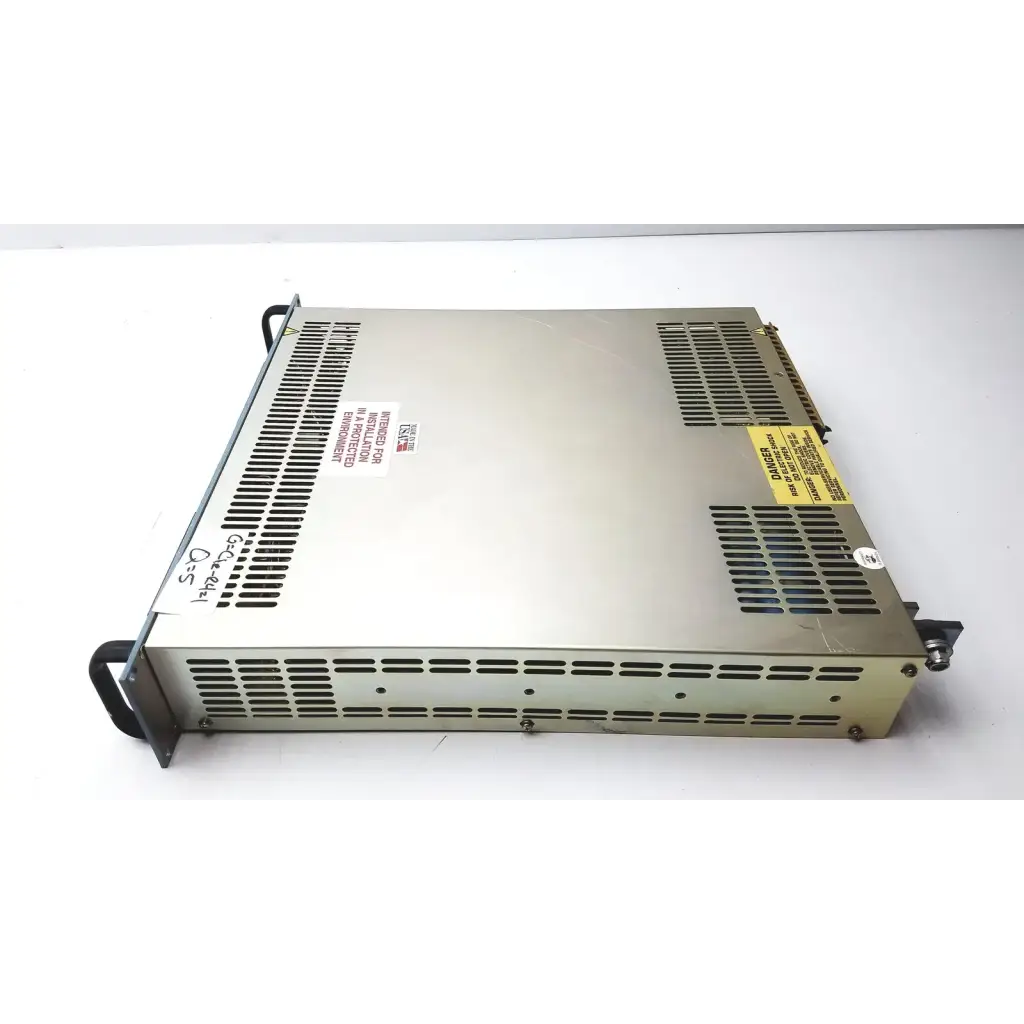 Silver metallic electronic measurements ems power supply with ventilation grilles and warning labels showing the back side
