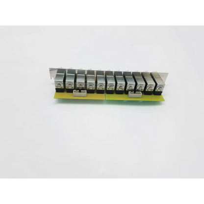 Silver metal relay module with black plastic components on green circuit board for electrovalves solenoid manifold with 11 valves