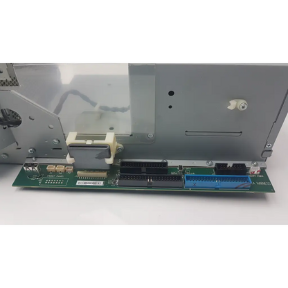 Green circuit board electronics module with black and blue connectors and beige plastic housing for power supply unit