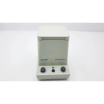 Beige eppendorf 5415c analog centrifuge with two black rotary dials and green power indicator for laboratory use