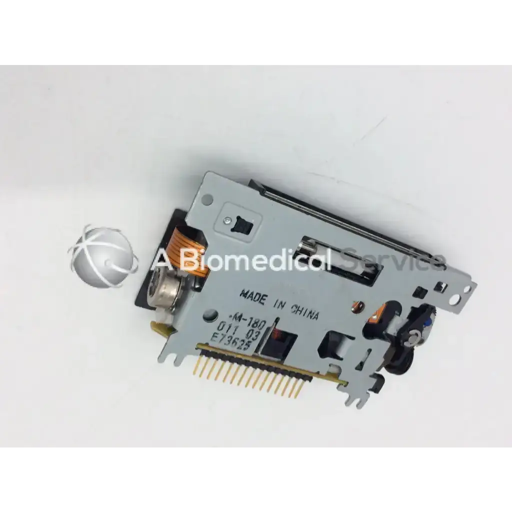 Silver-colored metallic epson m-180 mini printer mechanism with printed labels and gold-plated mechanism needle pins