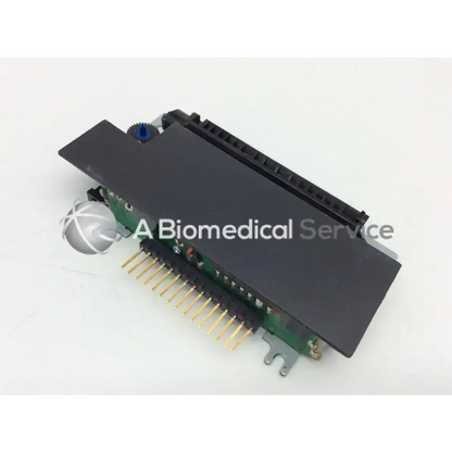 Black rectangular epson m-180 mini printer mechanism with green circuit board and gold-colored printer mechanism needle pins