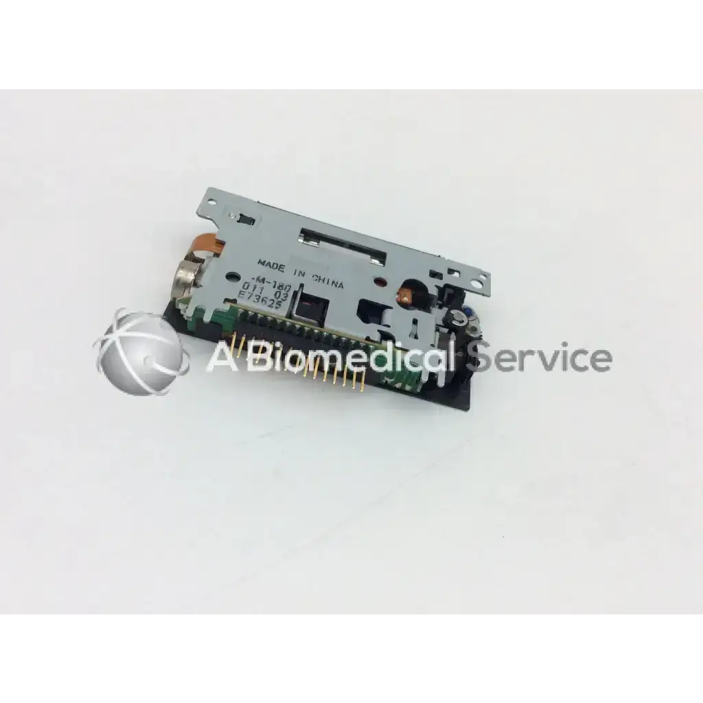 Silver-colored Epson M-180 mini printer mechanism needle with printed circuit board and metallic connectors for precise printing