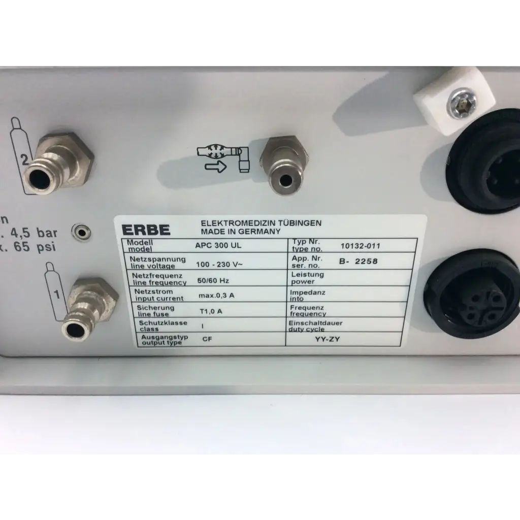 Silver metallic erbe apc electrosurgical console af5-29 with black circular ports and white technical specifications label