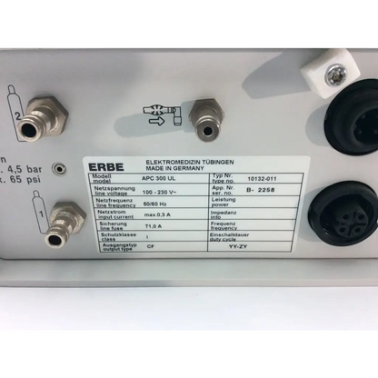 Silver metallic erbe apc electrosurgical console af5-29 with black circular ports and white technical specifications label