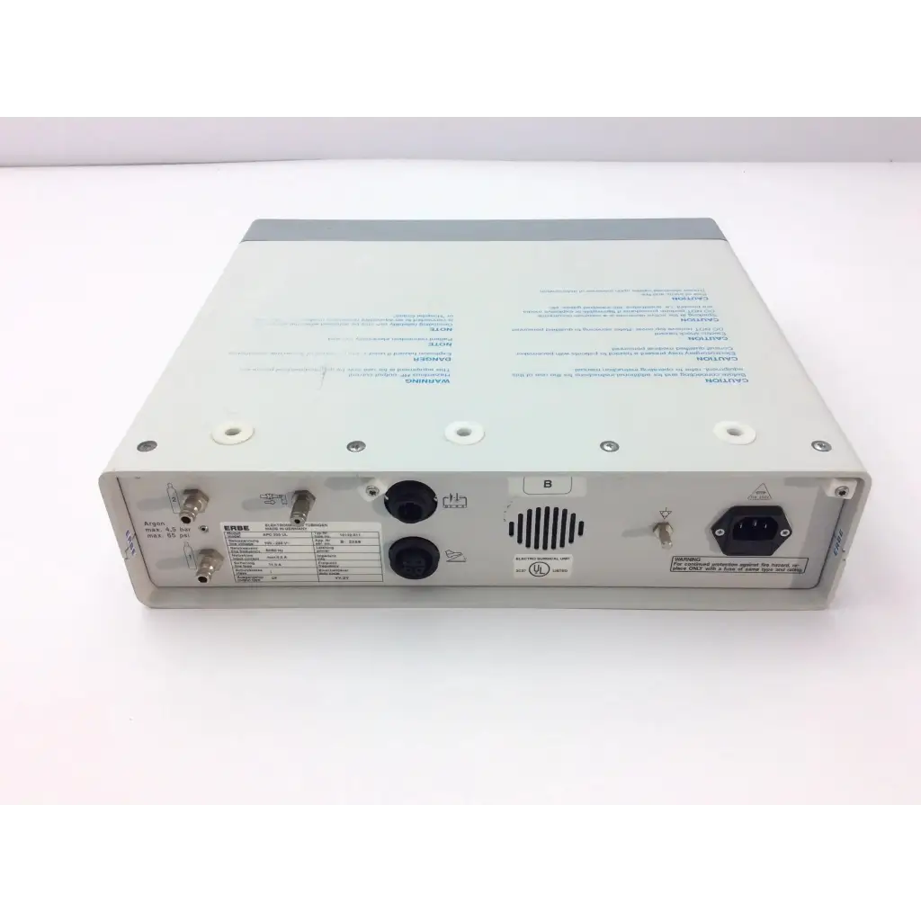 Rear panel of gray and white erbe apc 300 electrosurgical console with multiple ports power input and ventilation slots