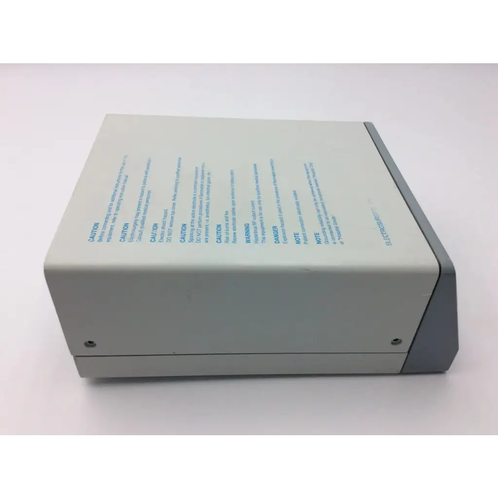 Gray rectangular erbe icc 200 electrosurgical unit af5-24 with matte finish and printed safety warnings on side