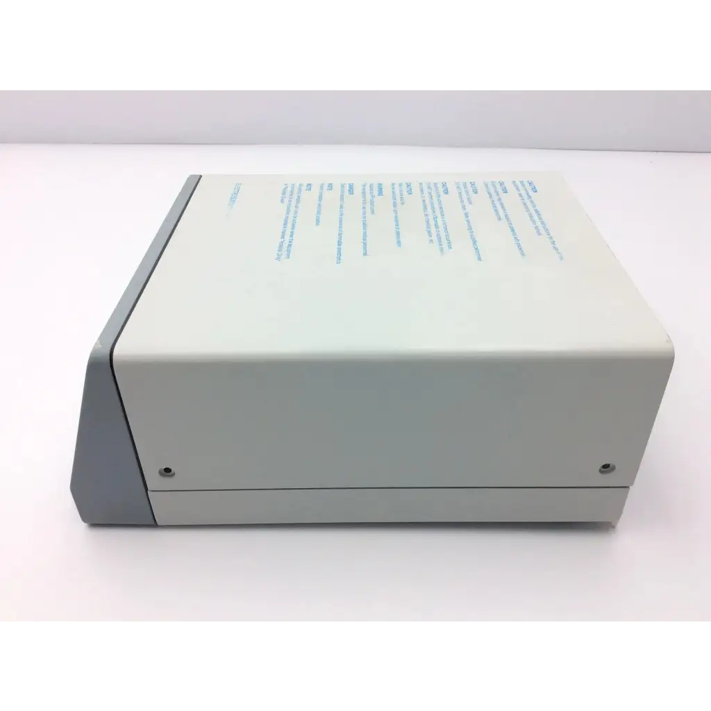 Beige and gray rectangular erbe icc 200 electrosurgical unit with blue printed text on top surface for surgical use