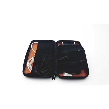 Black zippered tech case with orange lining and mesh compartments for organizing cables in evergreen telemetry pressure flow