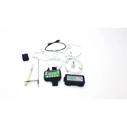 Black and green digital thermometer with screen buttons and wires for evergreen telemetry pressure velocity flow use