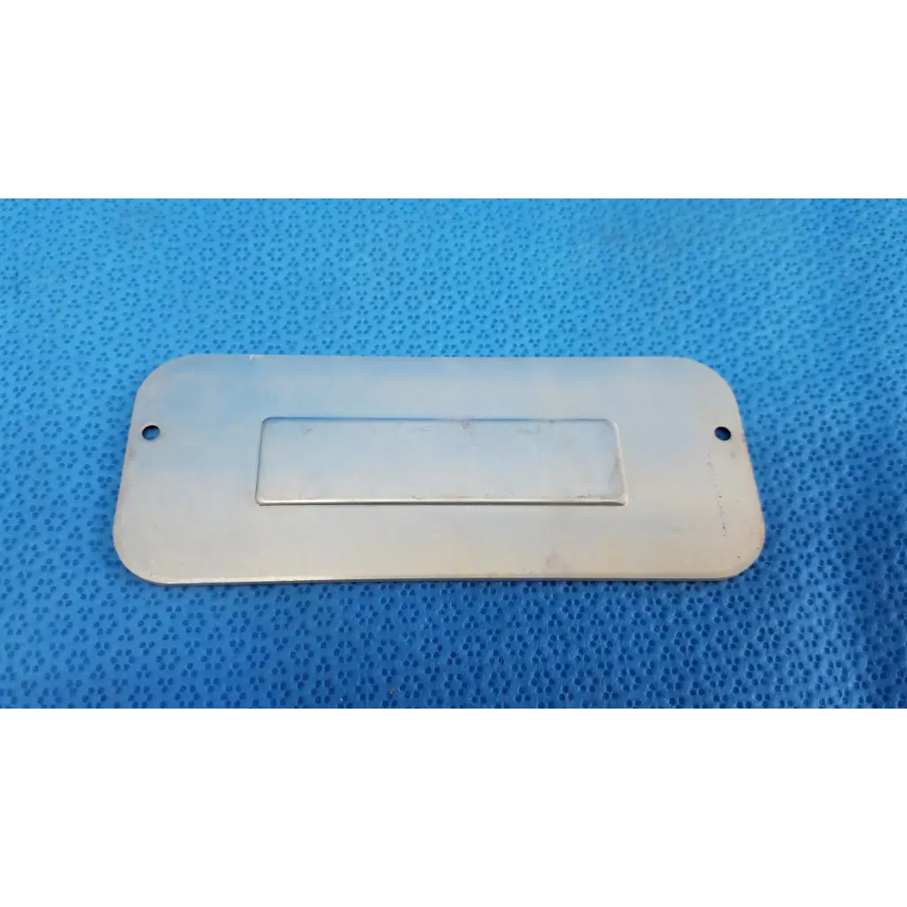 Silver rectangular metal external base mechanical interface trim cover plate with central recess and two top holes for topcon trc-nw8 fundus camera