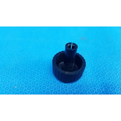 Black plastic external control panel extension dial adjustment knob with textured ribbed base for topcon fundus camera