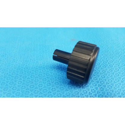 Black plastic external control panel extension dial adjustment knob with textured ridges and cylindrical stem for Topcon camera