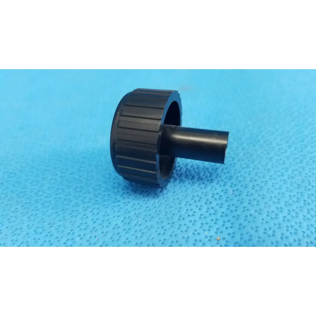 Black plastic ribbed adjustment knob with cylindrical stem for external control panel of topcon trc-nw6s fundus camera