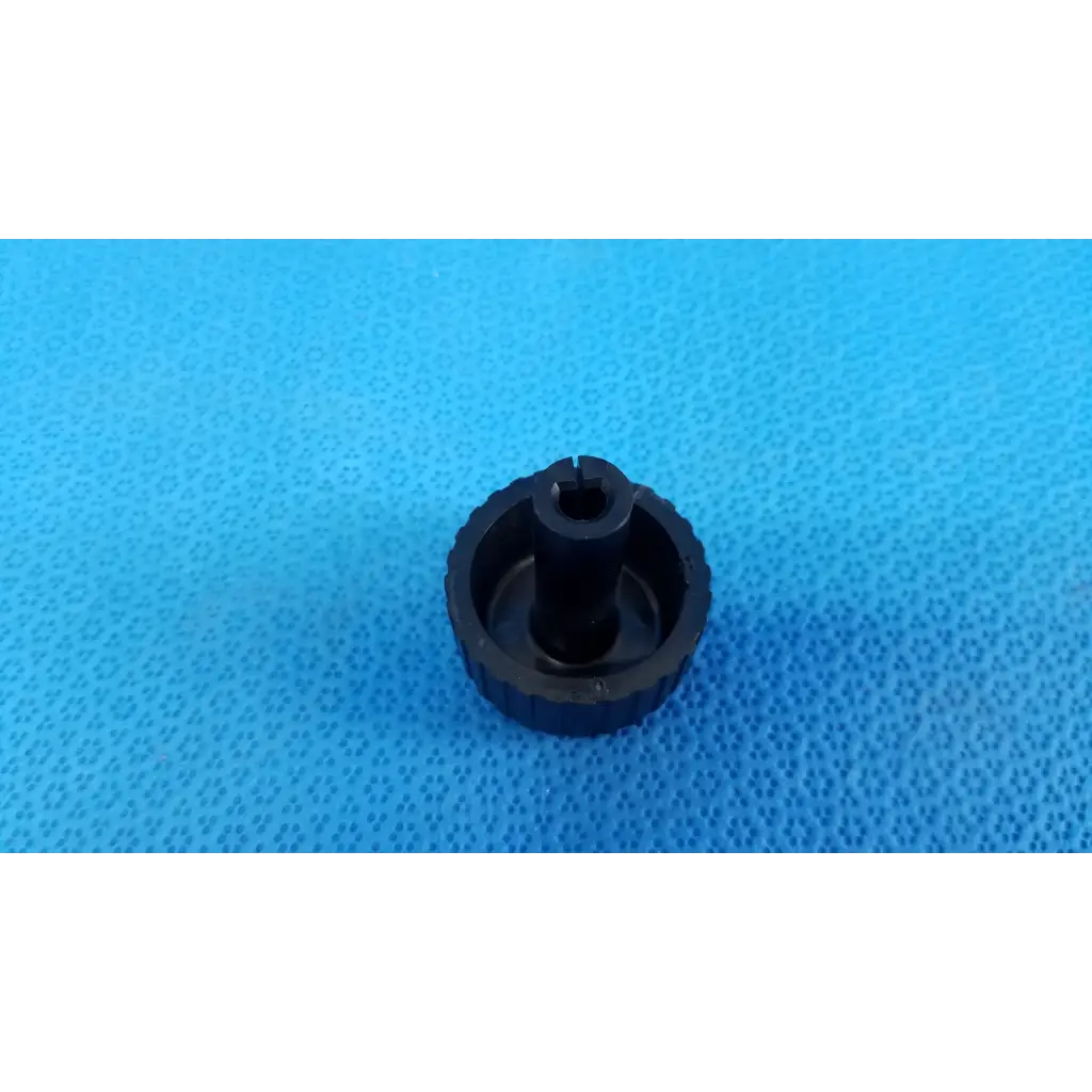 Black plastic external control panel extension dial adjustment knob with textured grip and hexagonal slot for topcon fundus camera