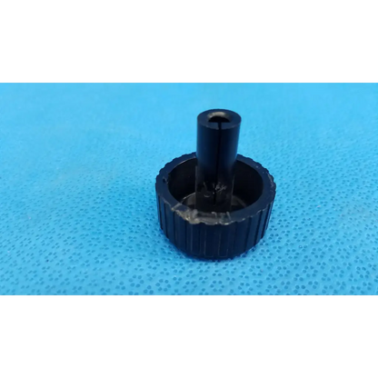 Black plastic external control panel extension dial adjustment knob with ribbed texture for topcon fundus camera