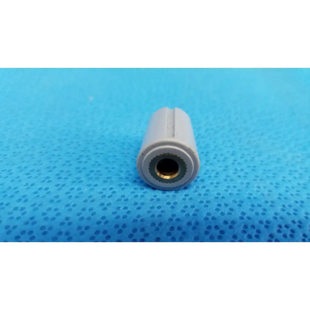 Gray plastic air hose connector with brass lining for external control panel rotary dial adjustment knob with indicator stripe