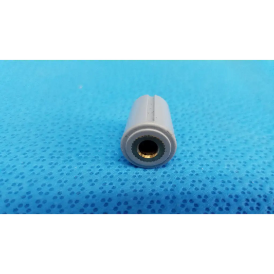 Gray plastic air hose connector with brass lining for external control panel rotary dial adjustment knob with indicator stripe