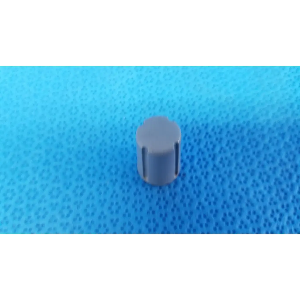 Gray plastic external control panel rotary dial adjustment knob with vertical grooves and indicator stripe for topcon camera