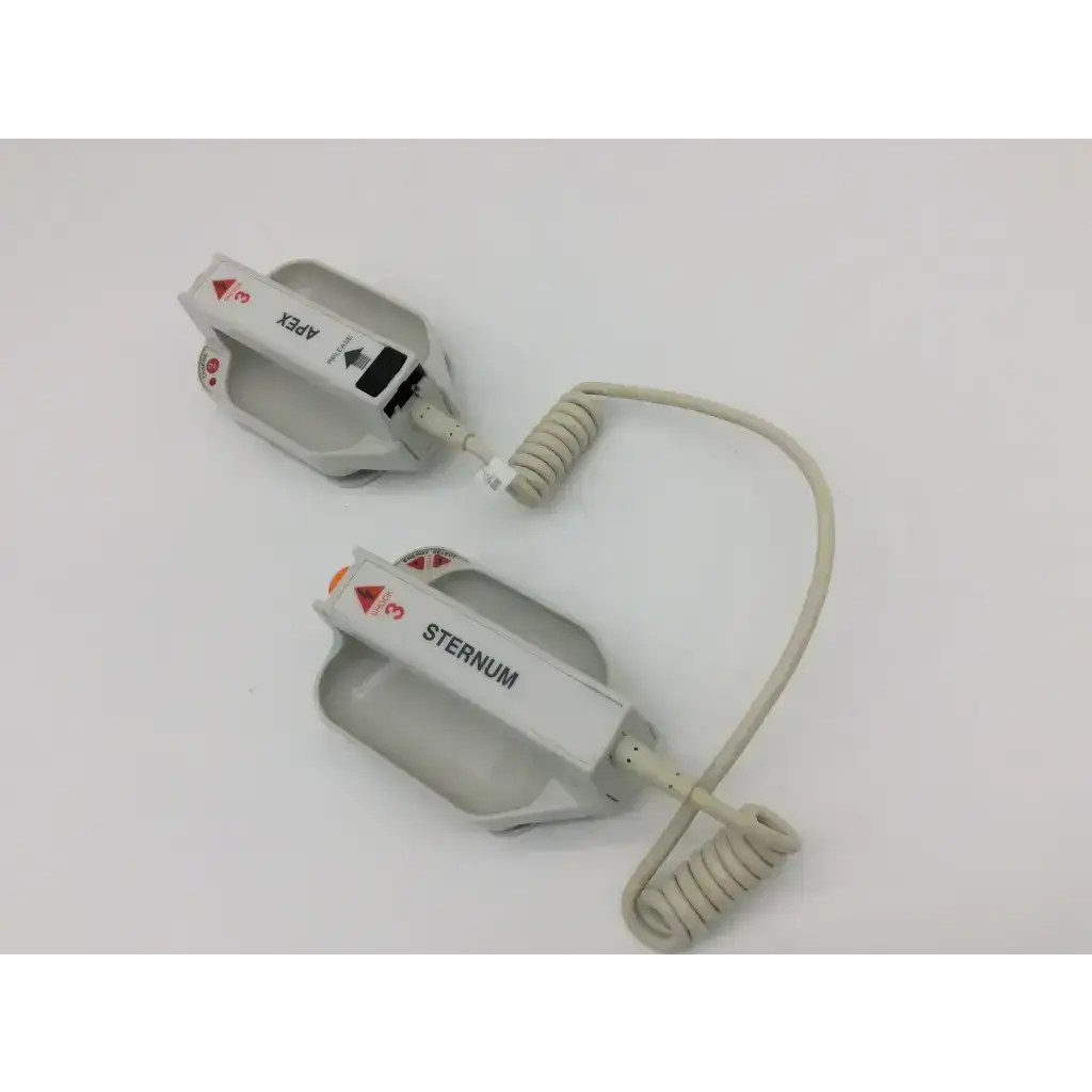 Gray plastic external paddle assembly electrode pads labeled apex and sternum with coiled cables for zoll defibrillators