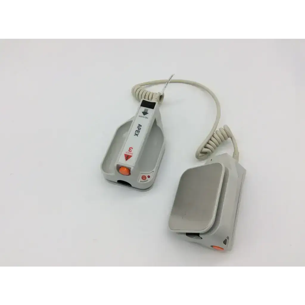 Gray external paddle assembly with orange button and coiled cable for zoll apex and sternum defibrillators