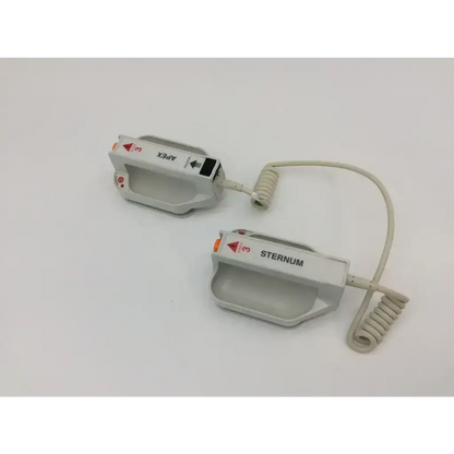 White plastic external paddle assembly with apex and sternum labels and coiled cables for zoll defibrillators