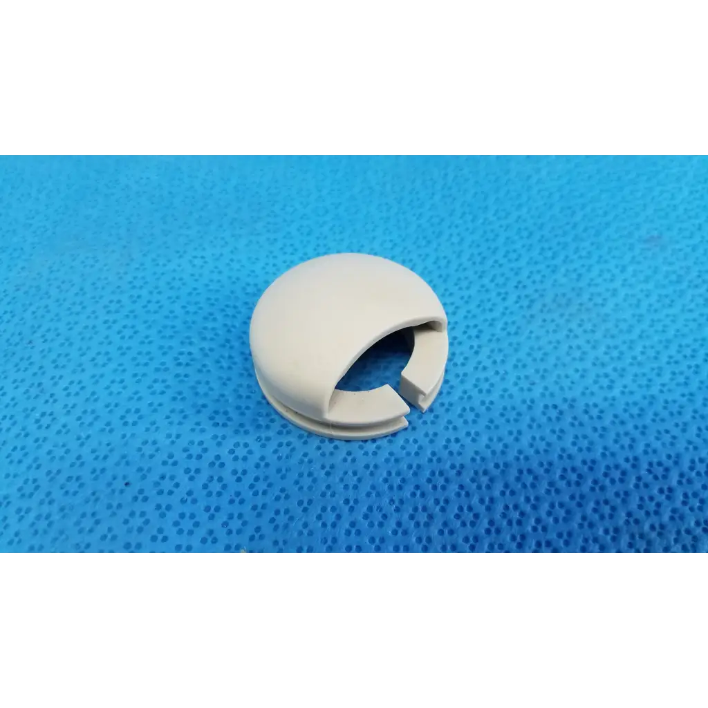 Off-white plastic joystick mechanical neck base collar ring cover shield with split opening for wire passage