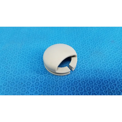 Off-white plastic joystick mechanical neck base collar ring cover shield with split opening for wire passage