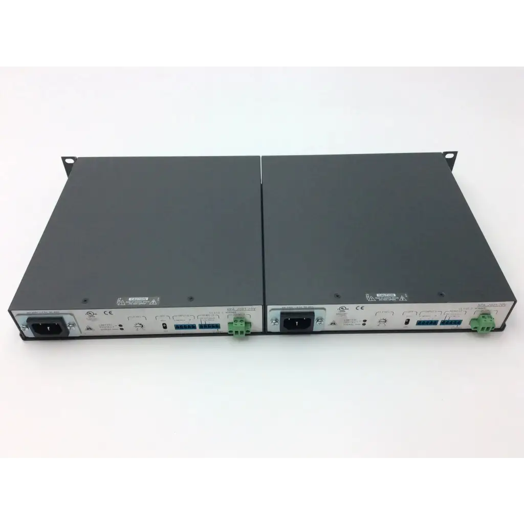 Two black rack-mountable power distribution units with green terminal blocks and silver panels for extron xtra xpa amplifier