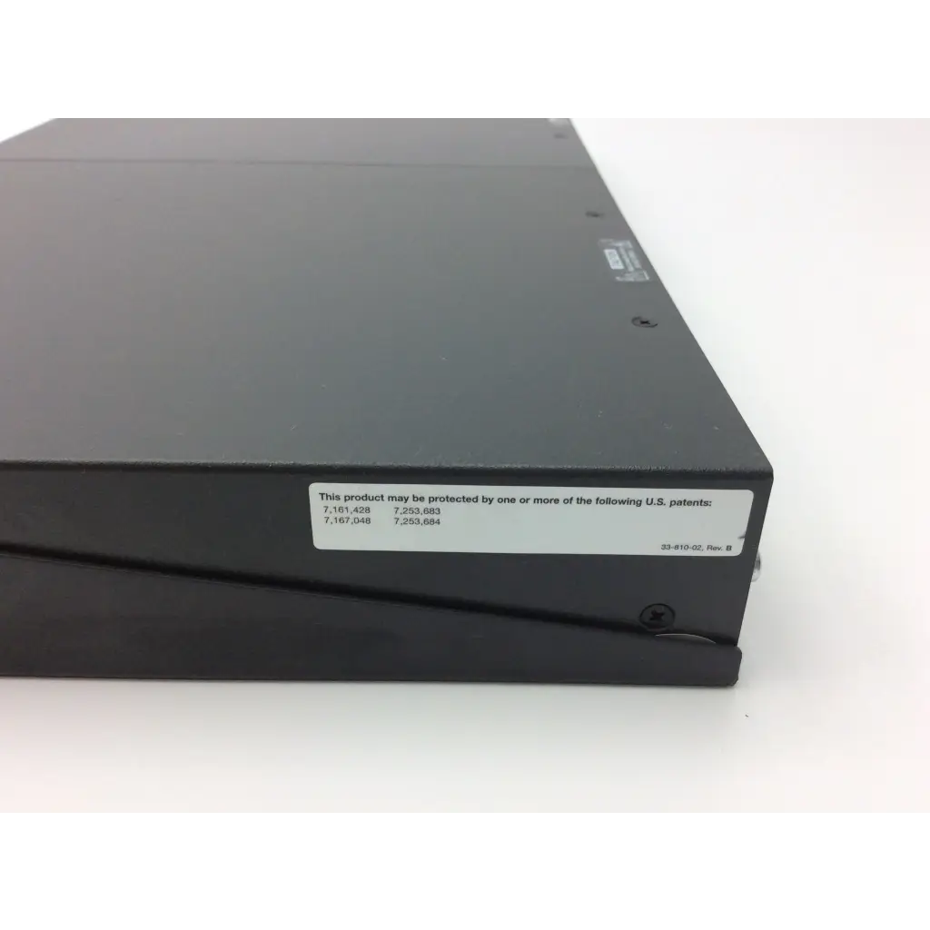 Black rectangular extron xtra xpa 2001 power amplifier with matte finish and white patent label on its side