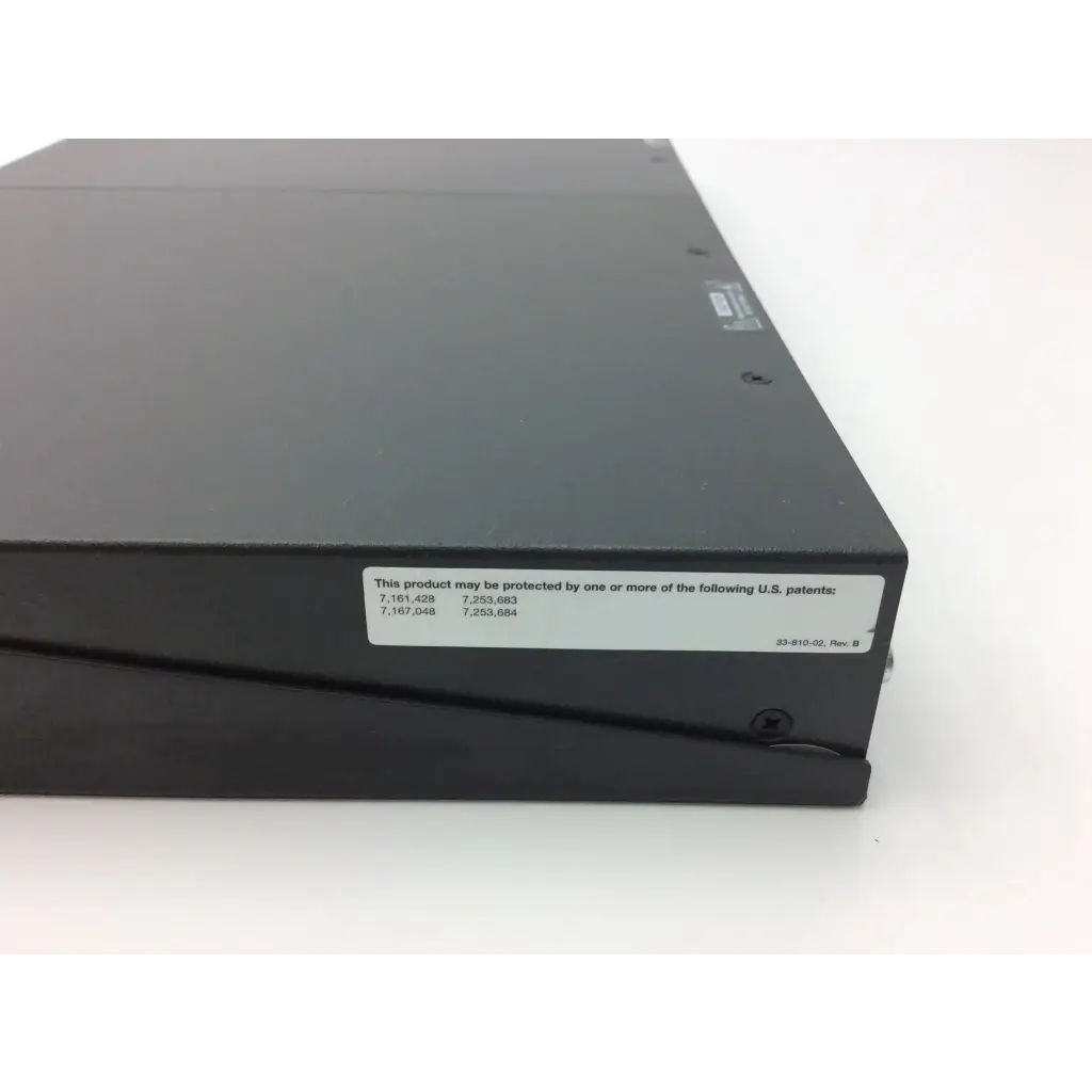 Black rectangular extron xtra xpa 2001 power amplifier with matte finish and white patent label on the side