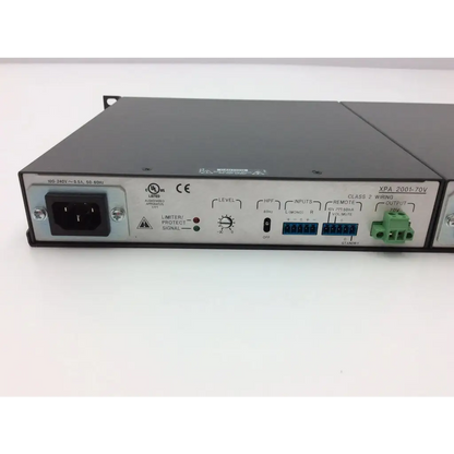Black metal rack-mount extron xtra xpa 2001 power amplifier with labeled inputs outputs and control knobs