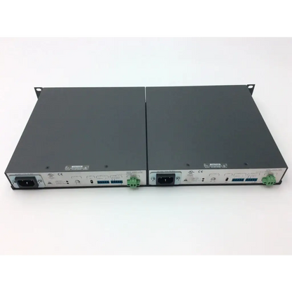 Two black rack-mountable power distribution units with green terminal blocks and silver front panels for extron xtra xpa 2001 power amplifier
