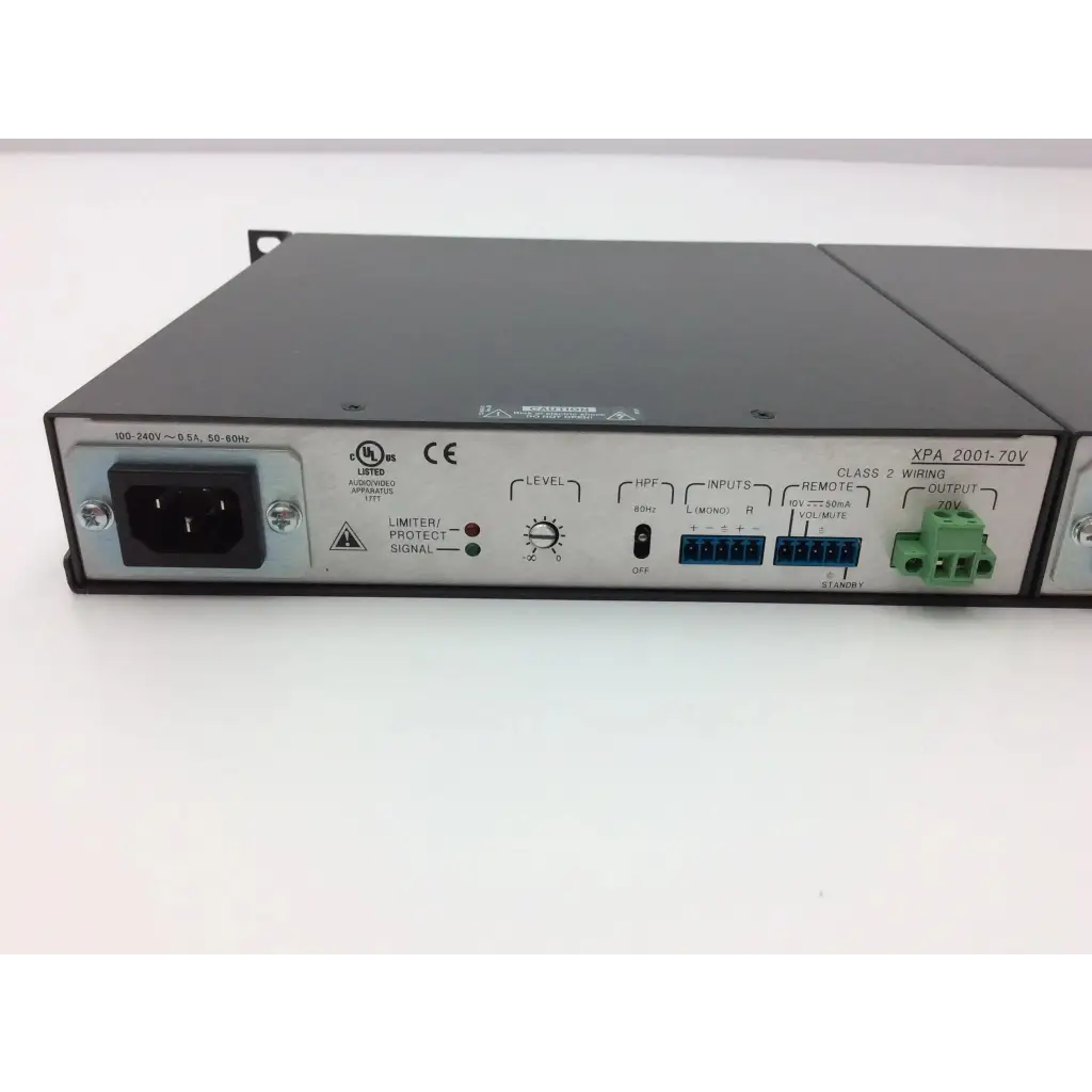 Black metal rack-mount extron xtra xpa 2001 power amplifier with labeled inputs outputs and control knobs for audio use