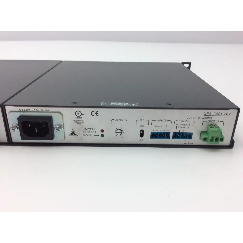 Black metal rack-mount extron xtra xpa 2001 power amplifier with silver panel input output connectors level knob and green terminal blocks