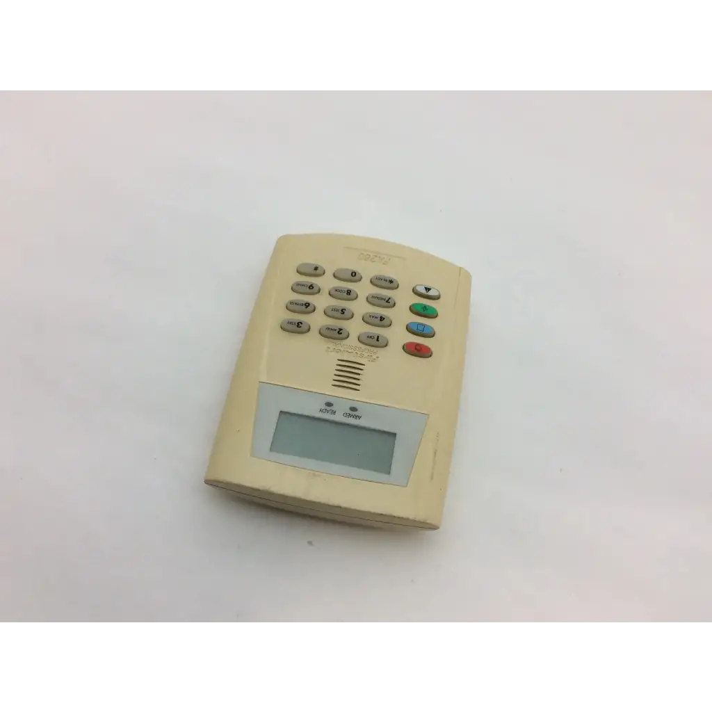 Beige plastic security keypad with digital display and colored buttons from first fa260 wayne alarm systems