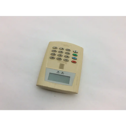 Beige plastic security keypad with digital display and colored buttons from first fa260 wayne alarm systems