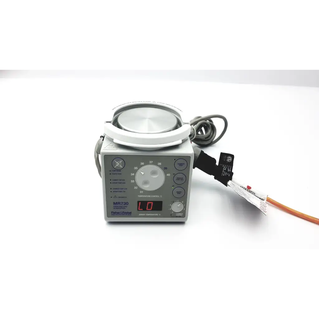 Gray paykel humidifier mr730 medical device with circular top and digital display for respiratory care