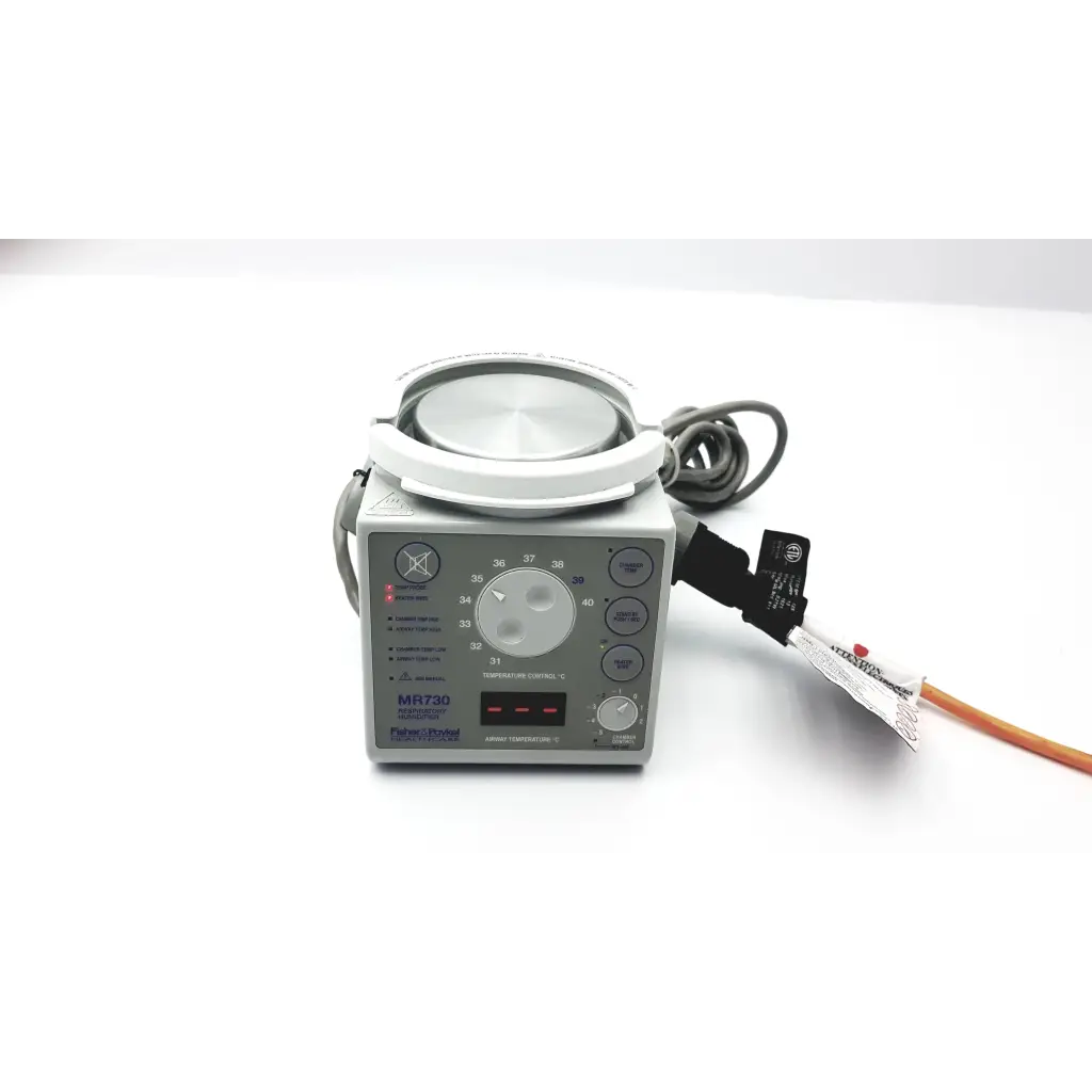 Gray fisher & paykel humidifier mr730 with a circular white head and control panel featuring dials and digital displays