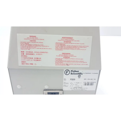 Fisher scientific fs20 ultrasonic cleaner with white plastic casing and multilingual safety warning label visible