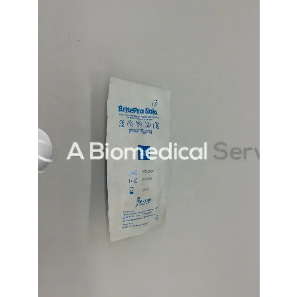White packaged britepro solo sterile surgical gloves shown with flexicare britepro fiber optic laryngoscope handle with batteries