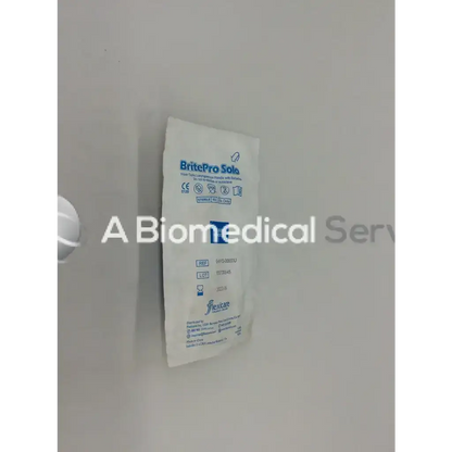 White packaged britepro solo sterile surgical gloves shown with flexicare britepro fiber optic laryngoscope handle with batteries