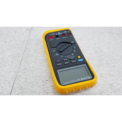 Yellow and black fluke 87 true rms digital handheld multimeter with rotary dial digital display and multiple input jacks