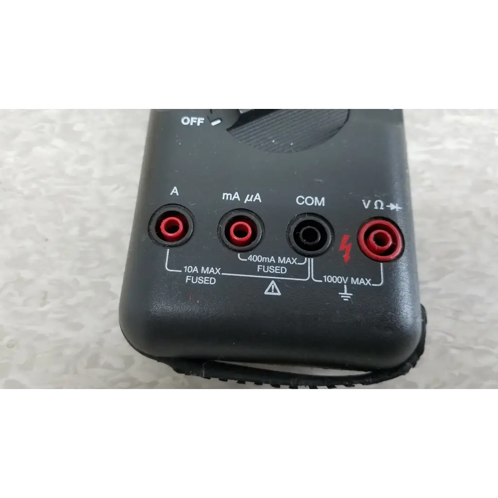 Black fluke 87 true rms digital handheld multimeter with red and black test leads ports for electrical measurements